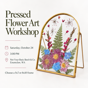 Promotional graphic for a pressed flower art workshop, showing a gold-framed mirror with pressed flowers and greenery on a white background, alongside event text including date, time, location, and frame size options.