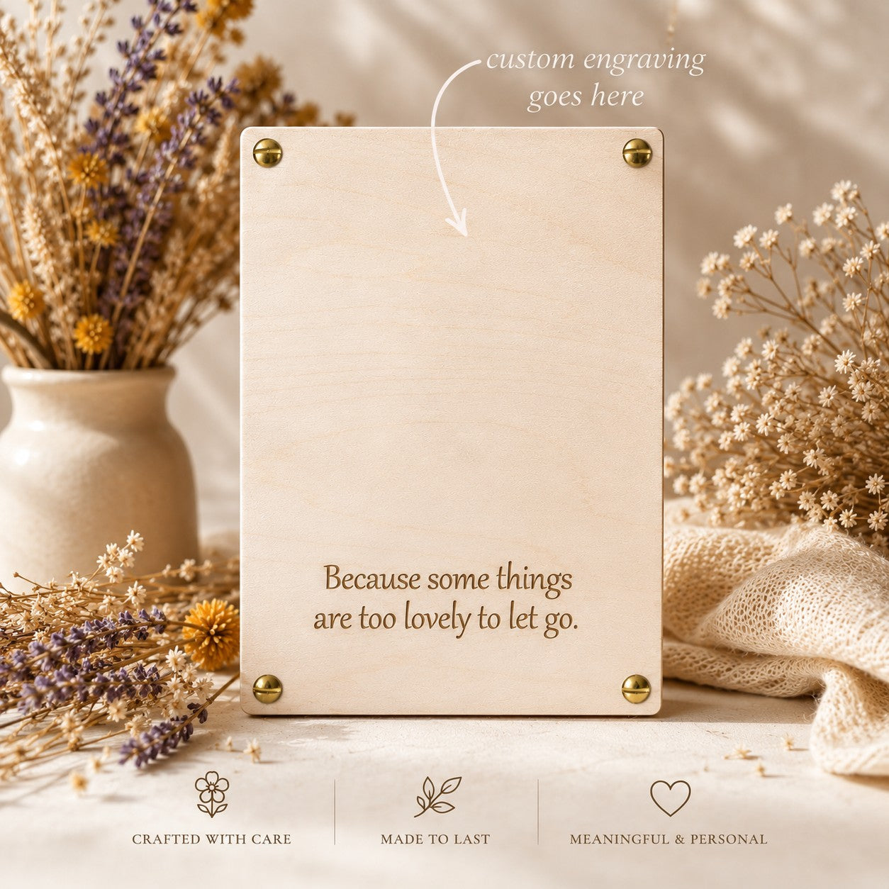 Back of a handmade wooden flower press with brass corner hardware showing the custom engraving area and laser-engraved quote "Because some things are too lovely to let go," styled with dried lavender, wildflowers, and linen — crafted with care, made to last, meaningful and personal.