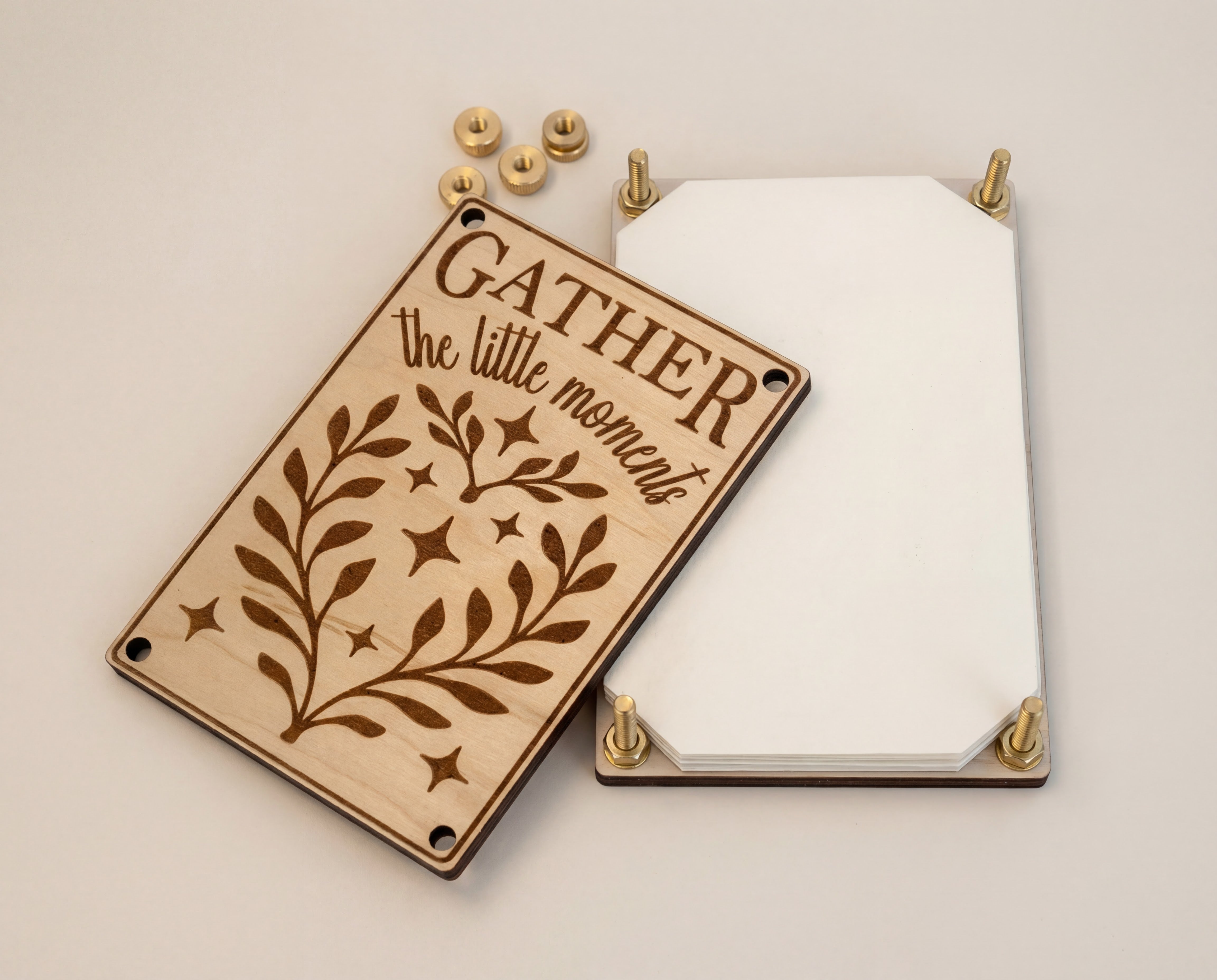 Handmade 4x6 maple flower press kit with “Gather the little moments” engraved top plate, brass bolts and thumb nuts, and stacked blotting paper shown separated on a clean white background.
