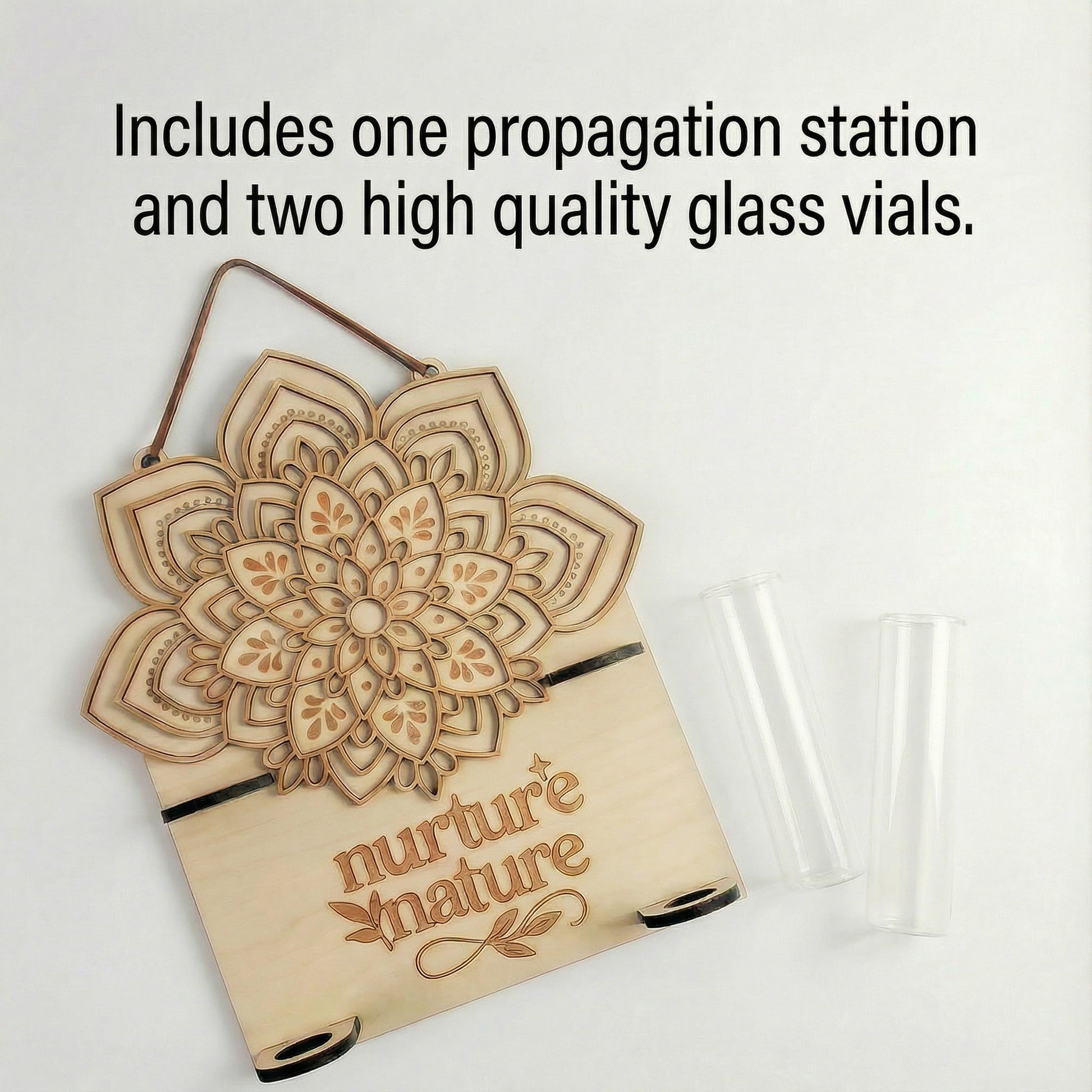 Product flat lay showing a laser-cut layered maple wood mandala propagation station with “nurture nature” engraving and suede hanging strap, alongside two clear glass vials, with overlay text stating it includes one propagation station and two high quality glass vials.